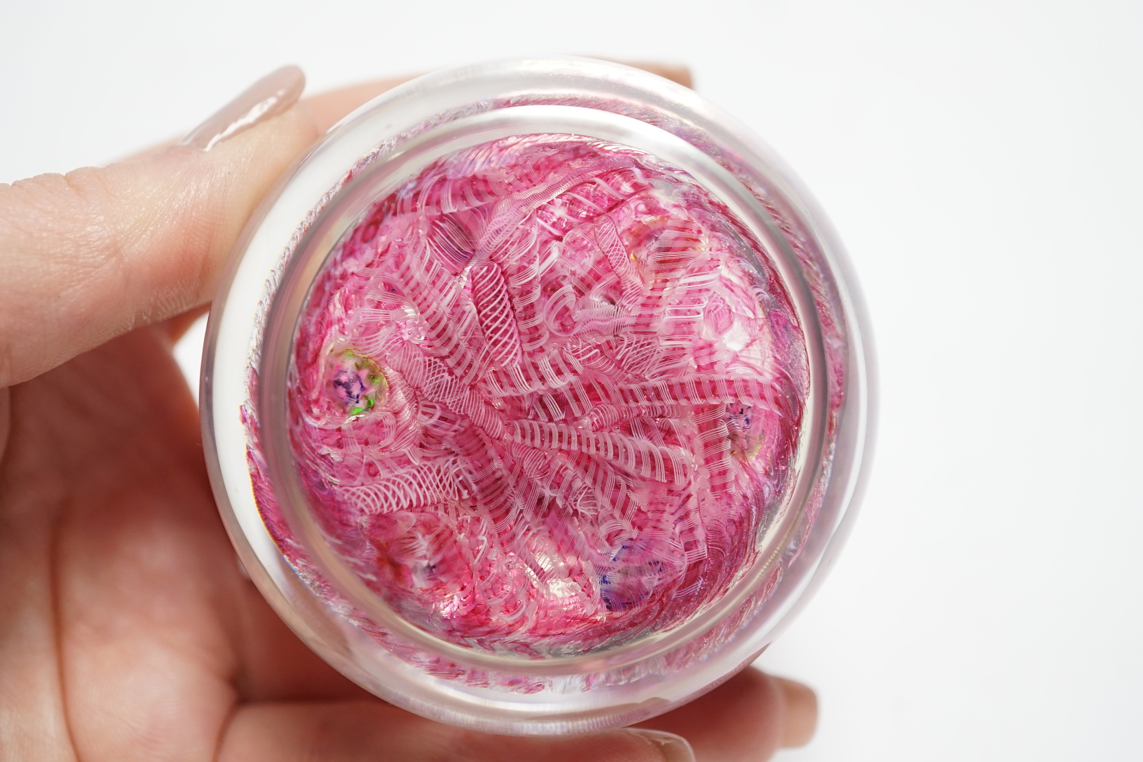 A Paul Ysart millefiori garland glass paperweight, Harland period, ‘H’ cane, with scrambled pink latticino ground, 6.5cm